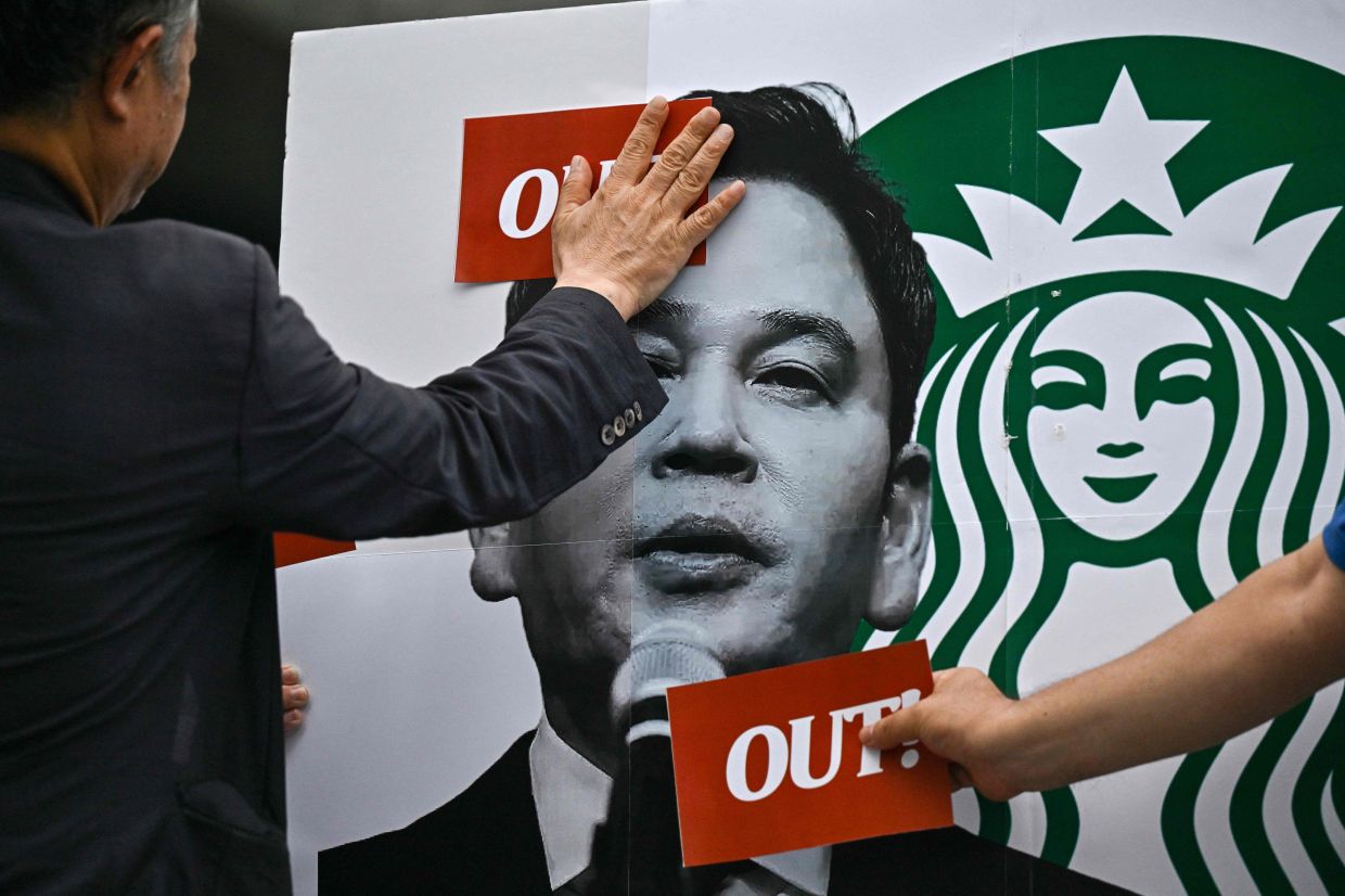 South Korean police question Starbucks operator executive over 'Tank Day' promotional blunder