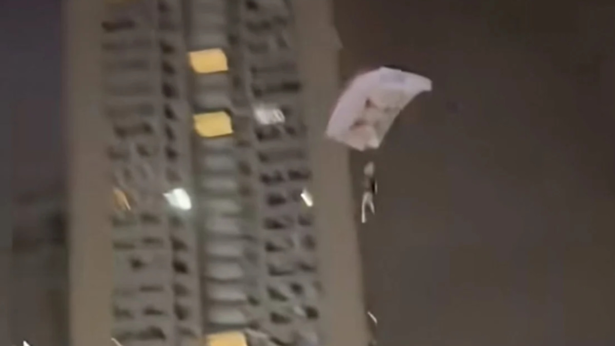 Chinese man detained after rooftop parachute stunt endangers residential area