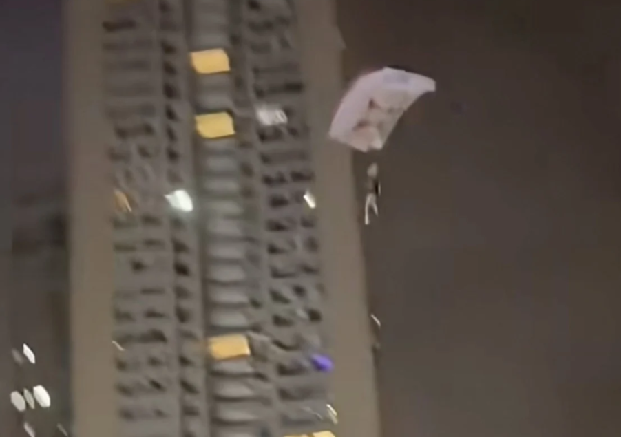 Chinese man detained after rooftop parachute stunt endangers residential area