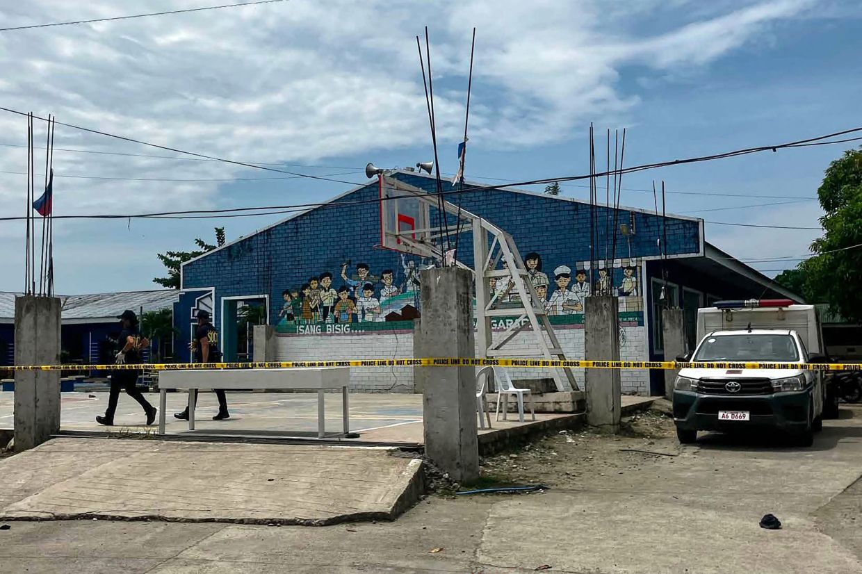 Two teenage students arrested after fatal shooting at Philippine high school leaves three dead