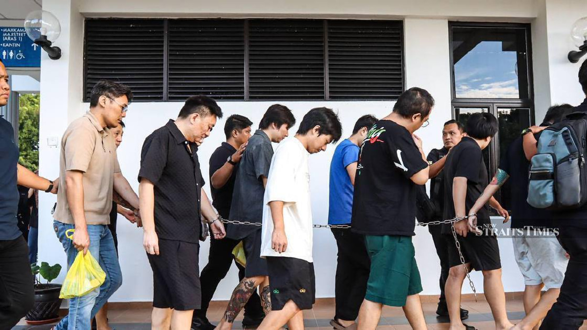 Nine Chinese nationals face trial over alleged romance scam network