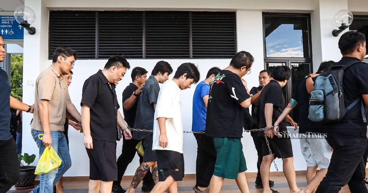 Nine Chinese nationals face trial over alleged romance scam network