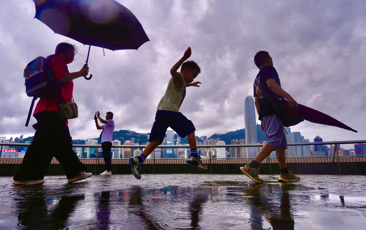 Rain breaks Hong Kong's grueling summer heat wave after temperatures hit 160-year record