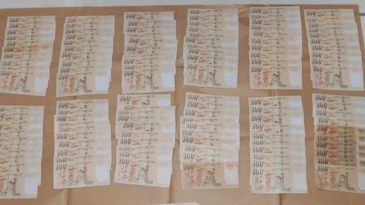 Two Chinese nationals charged in Singapore counterfeit currency scheme